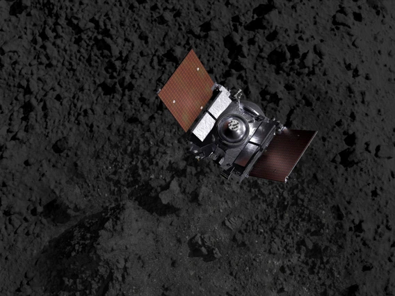 A spacecraft above an asteroid's terrain (artist's impression).