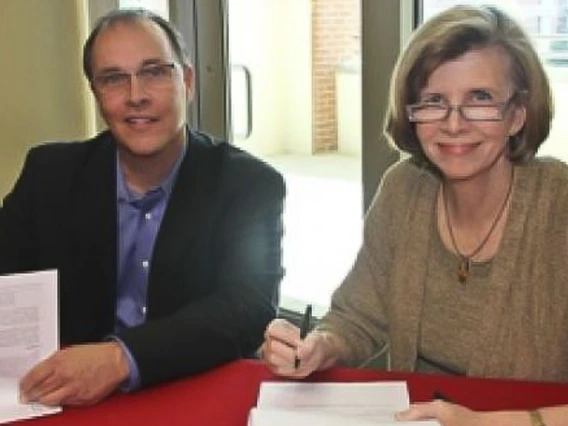 people signing a contract