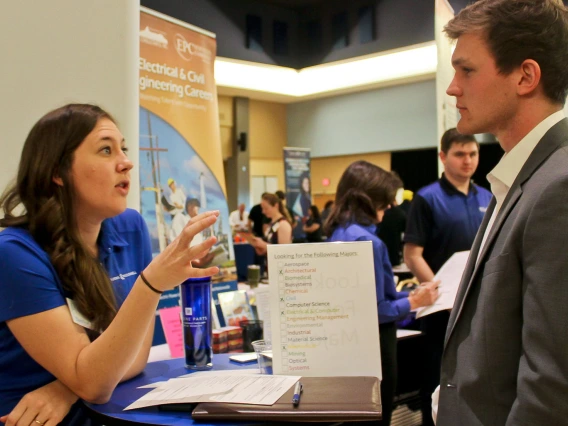 engineer and student at recruitment fair